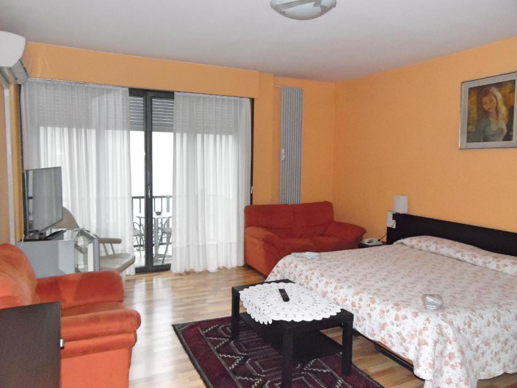 Postel nebo postele na pokoji v ubytování Swiss Lodge Nassa Garni
