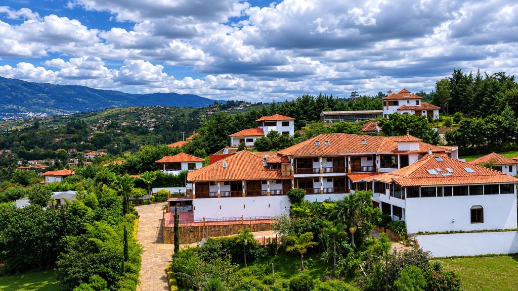 an aerial view of a house on a hill at Hotel PUENTE PIEDRA PARK in Villa de Leyva