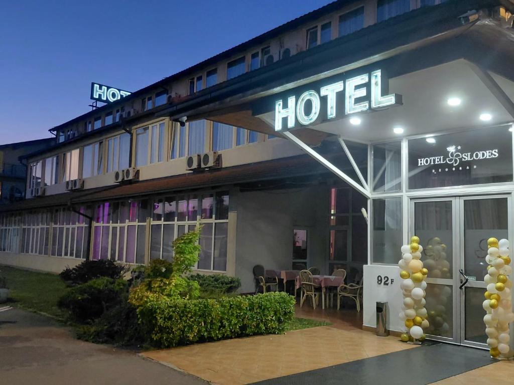 a hotel with a sign on the front of it at Hotel Slodes in Belgrade