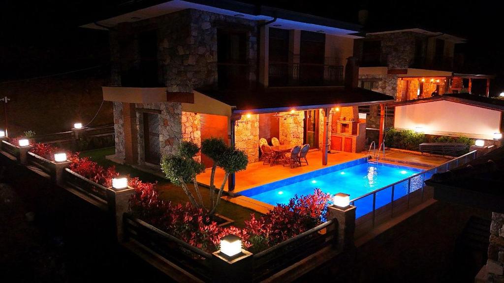 an overhead view of a swimming pool at night at Bozburunvillas in Bozburun