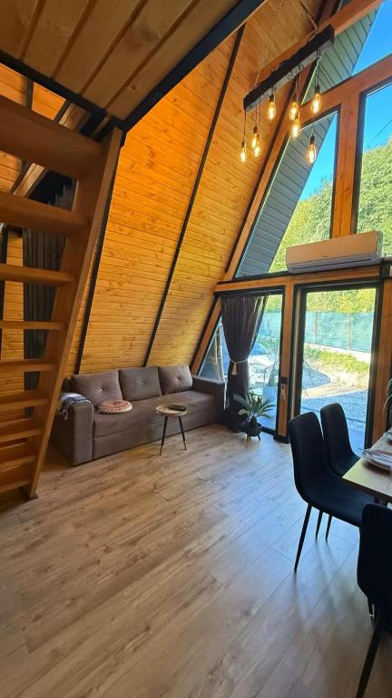 a living room with a couch and a table at AFRAME Solotvino in Solotvyno