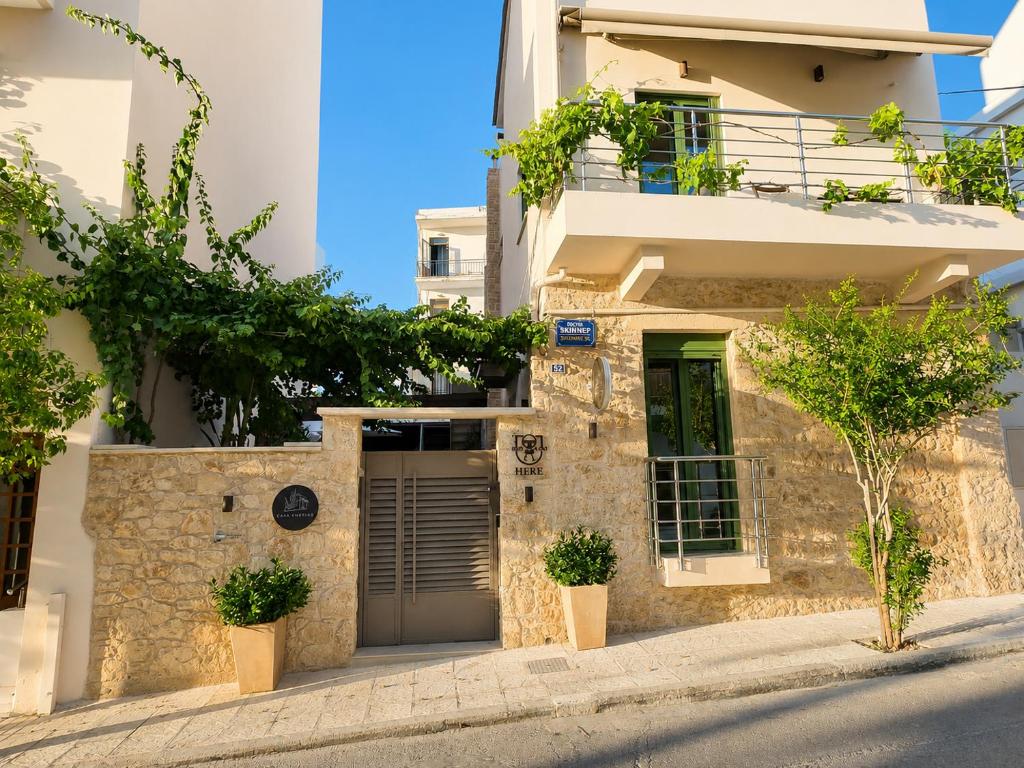 a house with a door and trees in front of it at Casa Enetiko in Chania