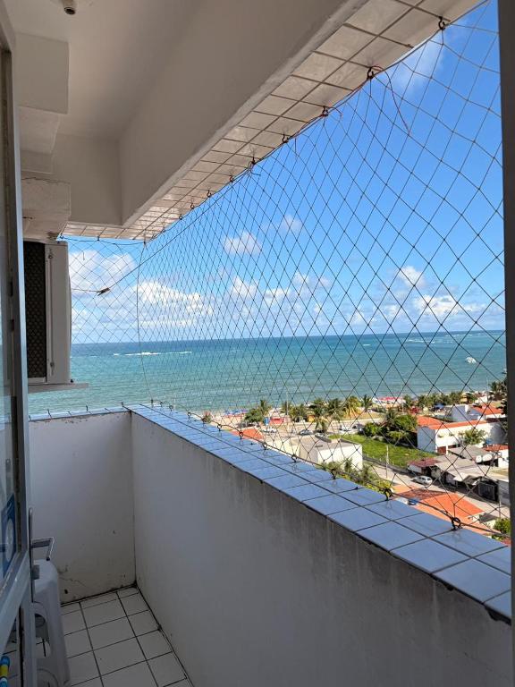 a view of the ocean from a balcony at Flat em Sao Jose da Coroa Grande in São José da Coroa Grande