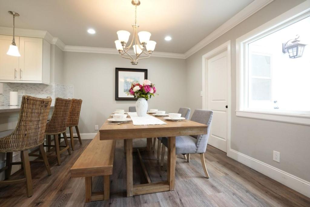 a dining room with a table and chairs at 4 bedroom, 3 bathrooms Pool Home in Orange