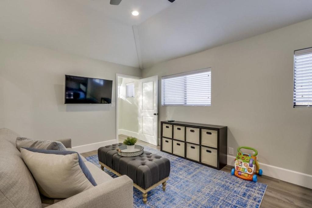 a living room with a couch and a table at 5 Bedroom plus loft room, 3 Bath home in Fullerton
