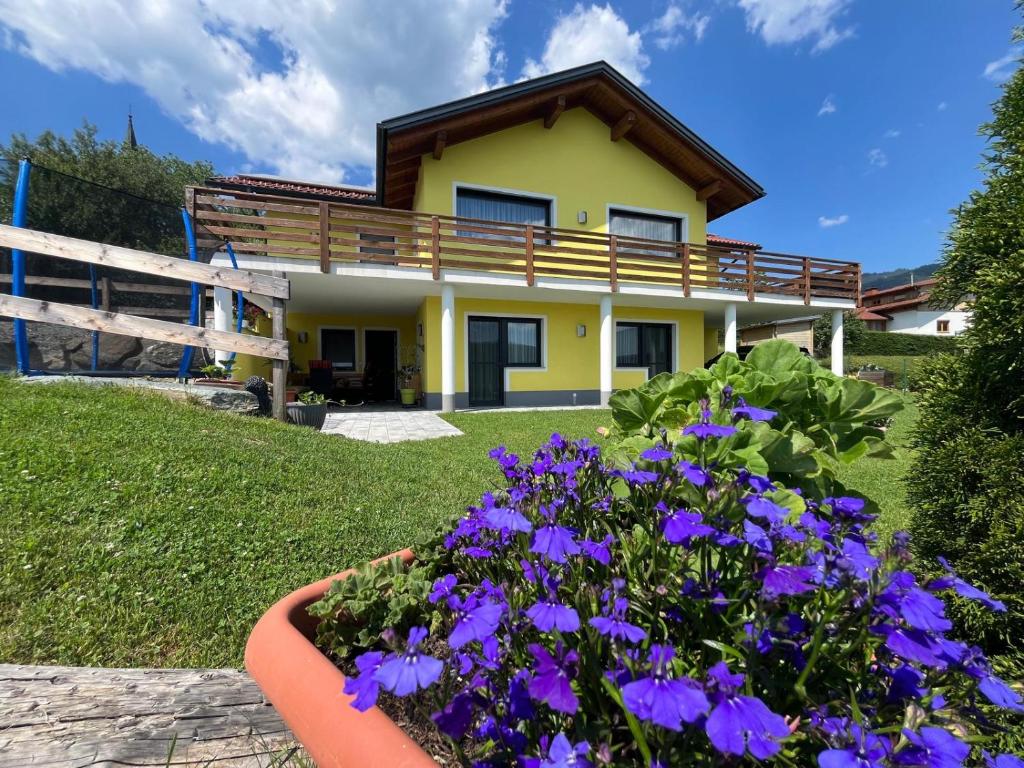 a house with purple flowers in front of it at Panoramablick Zirbitzkogel in Perchau am Sattel