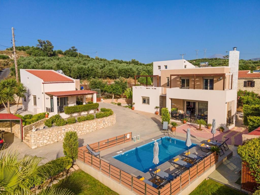 an aerial view of a house with a swimming pool at Villa Sandy Evi by Villa Select in Astérion