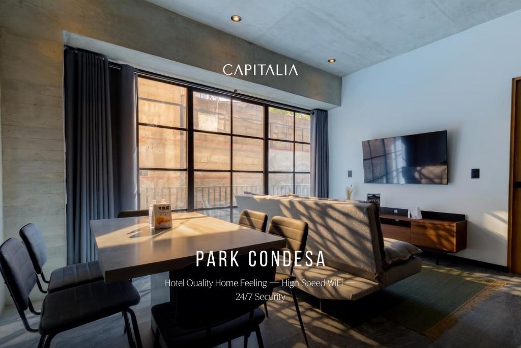 a dining room with a table and chairs in a room at Park Condesa by Capitalia in Mexico City
