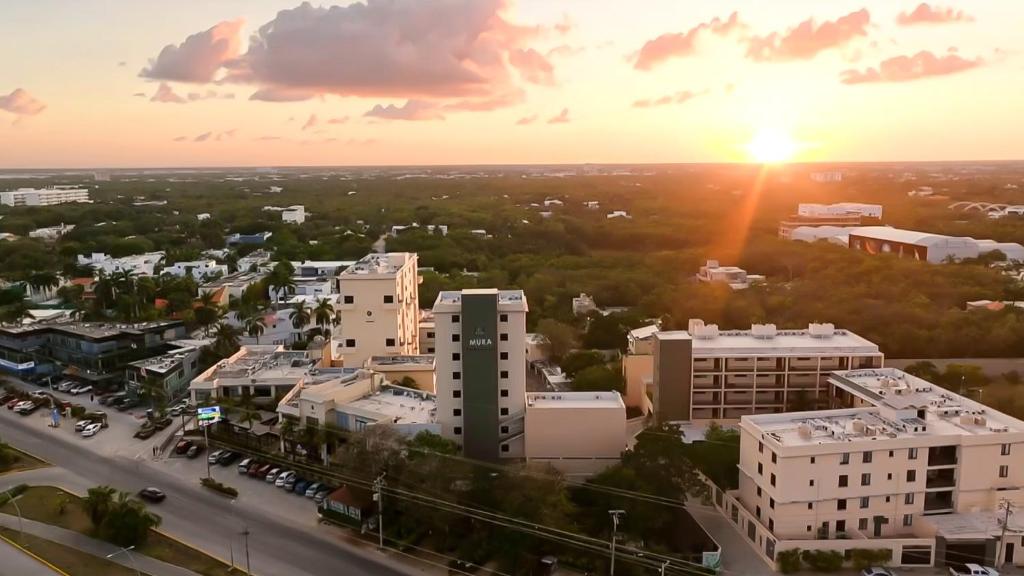 an aerial view of a city at sunset at Hotel Boutique Mura in Cancún