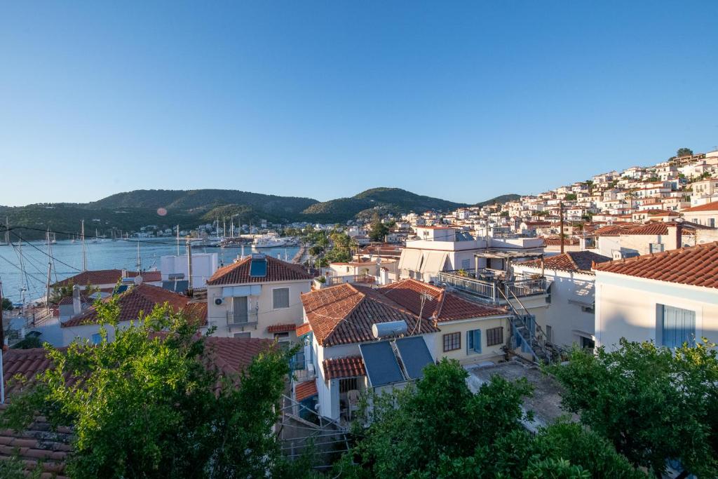 a view of a city with houses and a harbor at MARIA'S Roof Top View in Poros