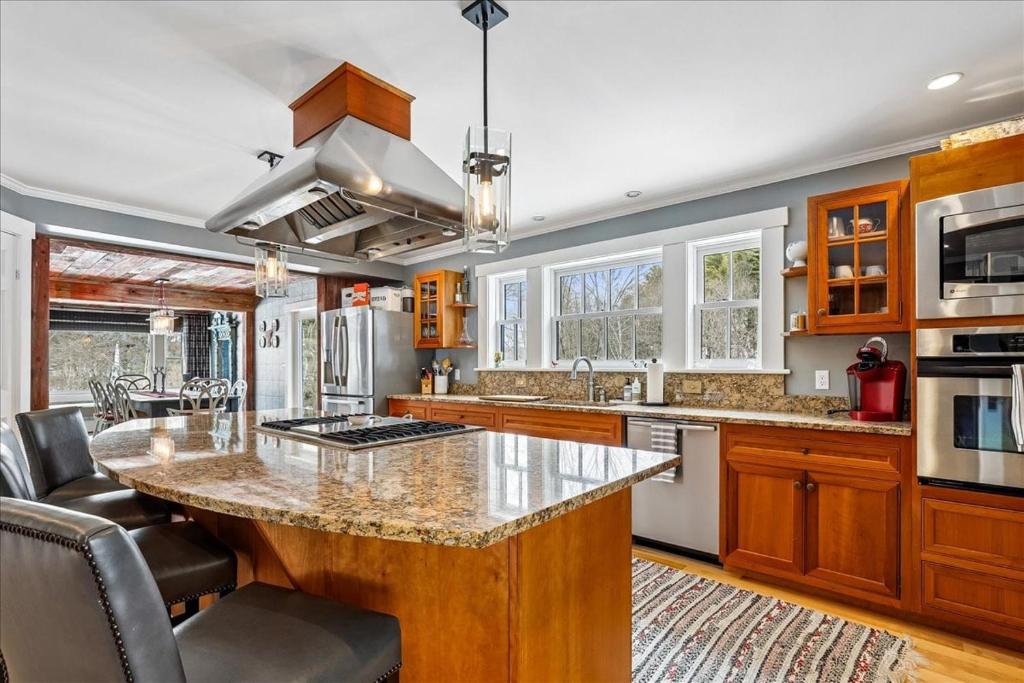 a kitchen with a large island in the middle at Stowestruck in Stowe