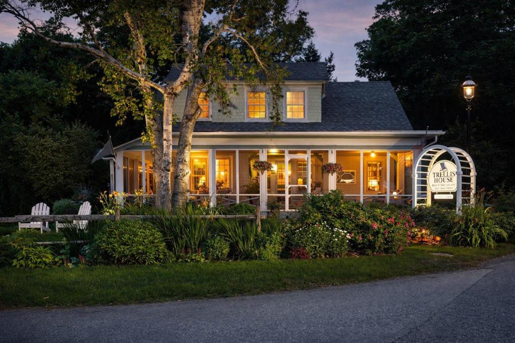 a house with lights on the front of it at The Trellis House in Ogunquit