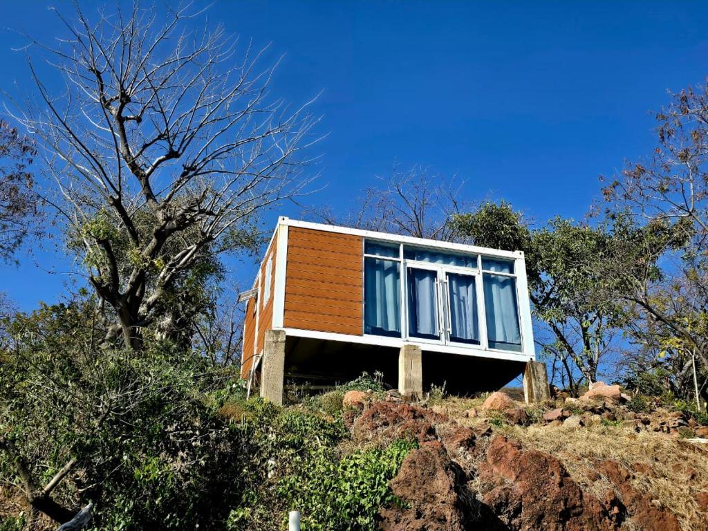 a house sitting on top of a hill at Abitare lodge Mezcala #2 in Isla de Mezcala