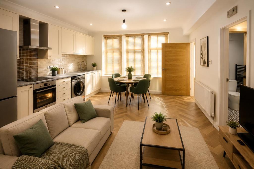 a living room with a couch and a table at Ai Stays Bentcliffe Suites in Moortown