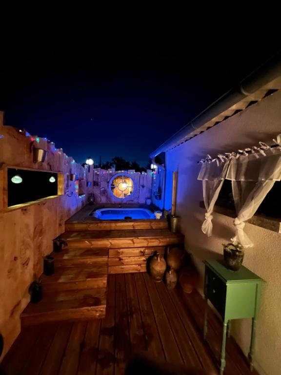 a view of a deck at night at Chez Laurie et Xavier studio 4 in Mignaloux-Beauvoir