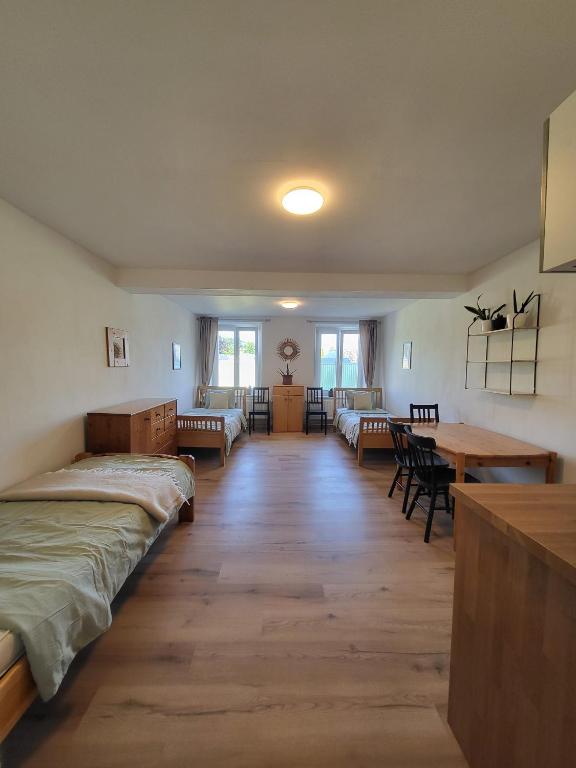 a living room with two beds and a dining room at Studio in Fürstenfeld