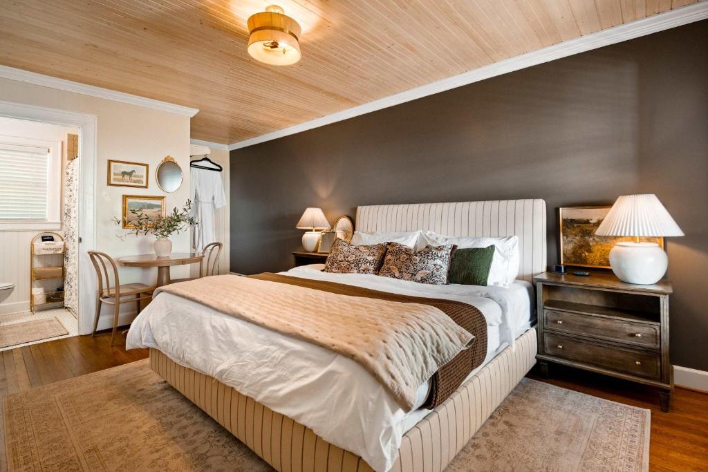 a bedroom with a large bed and a wooden ceiling at Historic Riverview Inn Three in Chattanooga