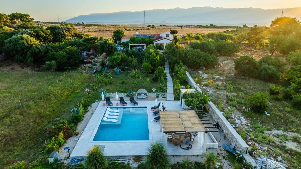 an overhead view of a swimming pool in a field at Villa Slatina near Zrce beach in Novalja