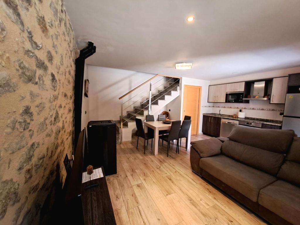 a living room with a couch and a table at Casa Rural Tarayuela in Cantavieja