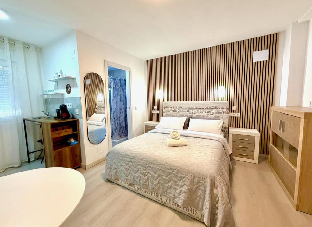 a bedroom with a bed with a teddy bear on it at Alteagroup Joy in Altea