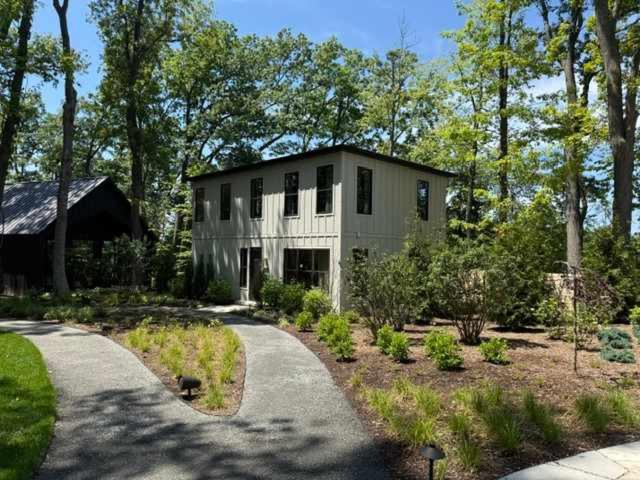 a house with a driveway leading to it at Maison Foxglove - Petite Acres Chateau in New Buffalo