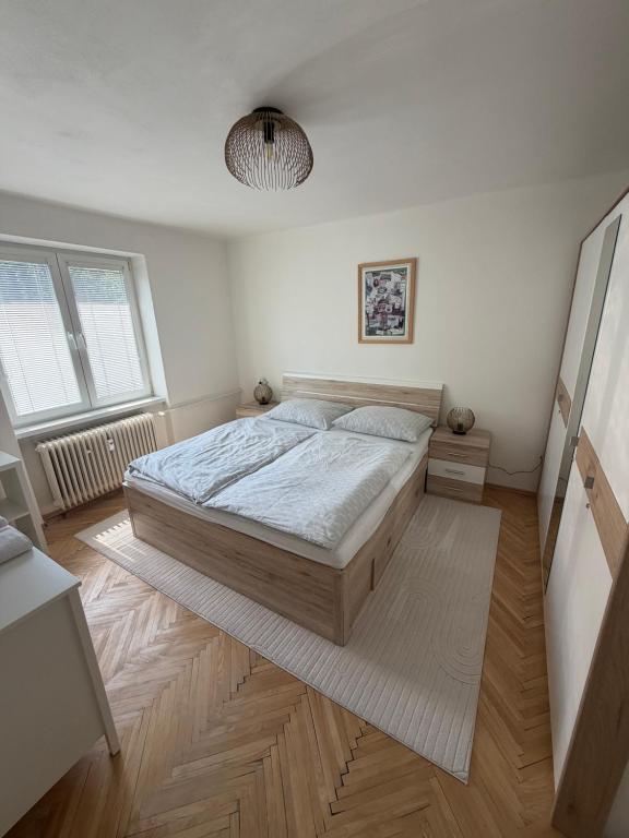 a bedroom with a large bed in a room at Apartmán Hora in Muránska Huta