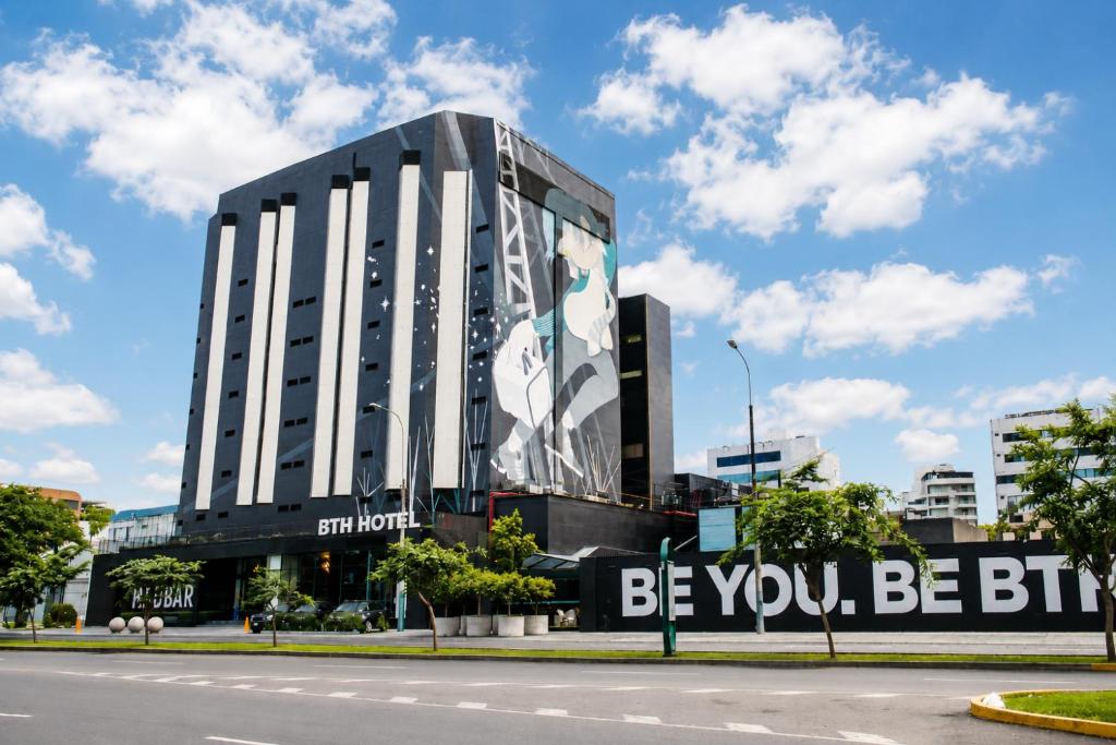 a building with a billboard on the side of it at BTH Hotel – Boutique Concept in Lima