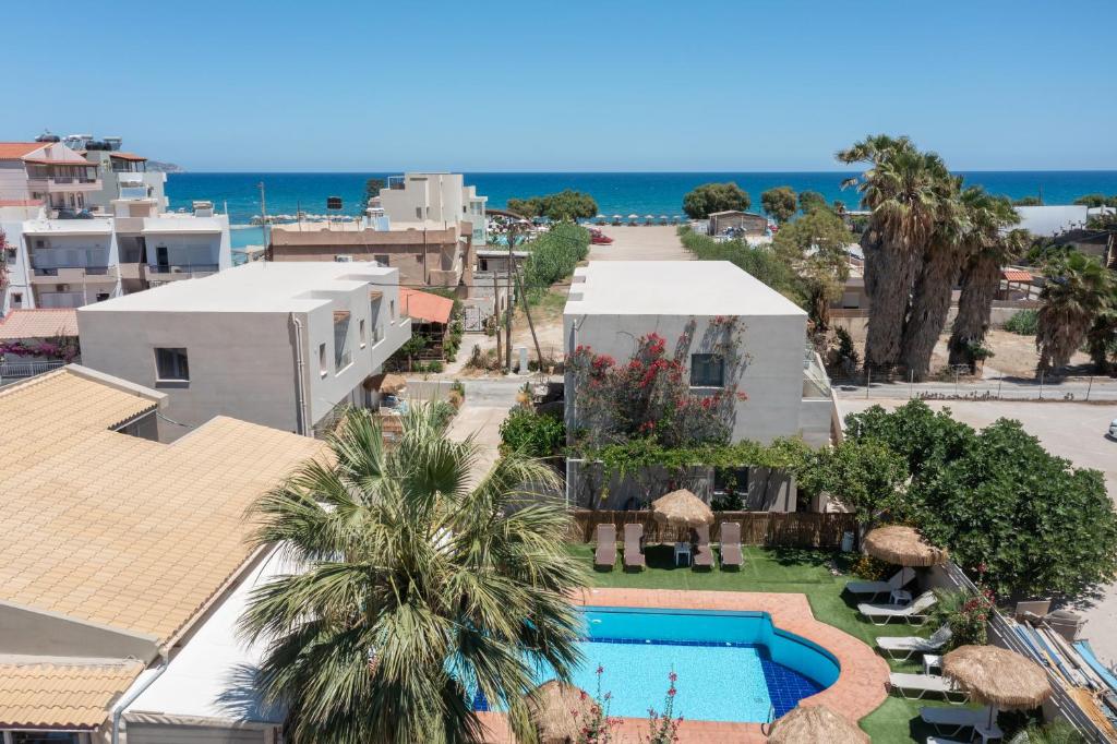 an aerial view of a resort with a swimming pool at Nikolas Apartments in Amoudara Herakliou