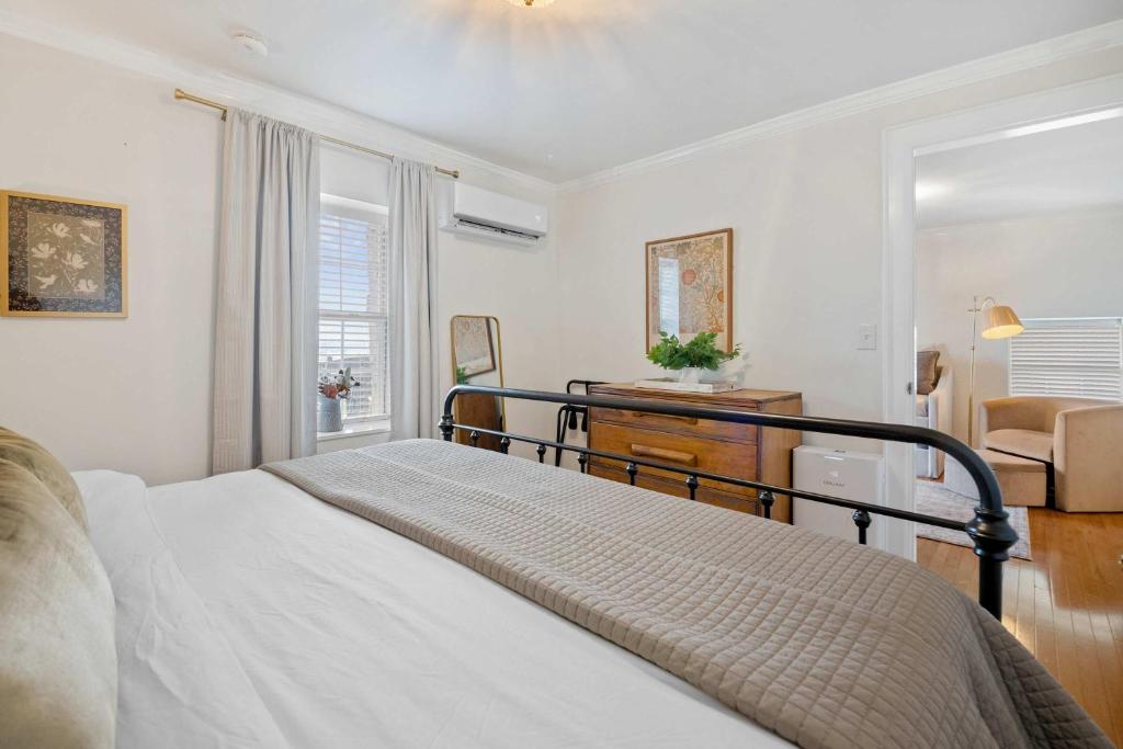a bedroom with a bed and a desk and a window at Historic Riverview Inn Suite Ten in Chattanooga