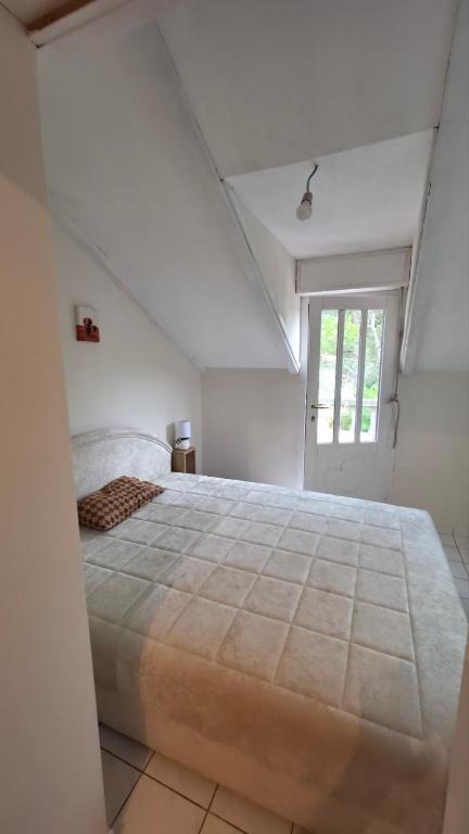a bedroom with a large bed and a window at Safari Luštica in Luštica