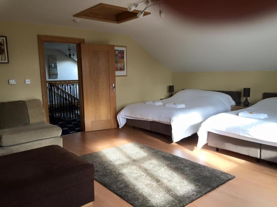 Postel nebo postele na pokoji v ubytování Red Gate House B&B