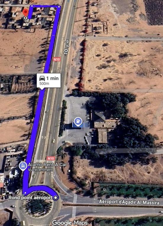 an overhead view of a road with a sign on it at Relax House 2 in Al Massira Airport