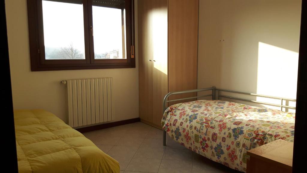 Postel nebo postele na pokoji v ubytování Il Grande Fiume