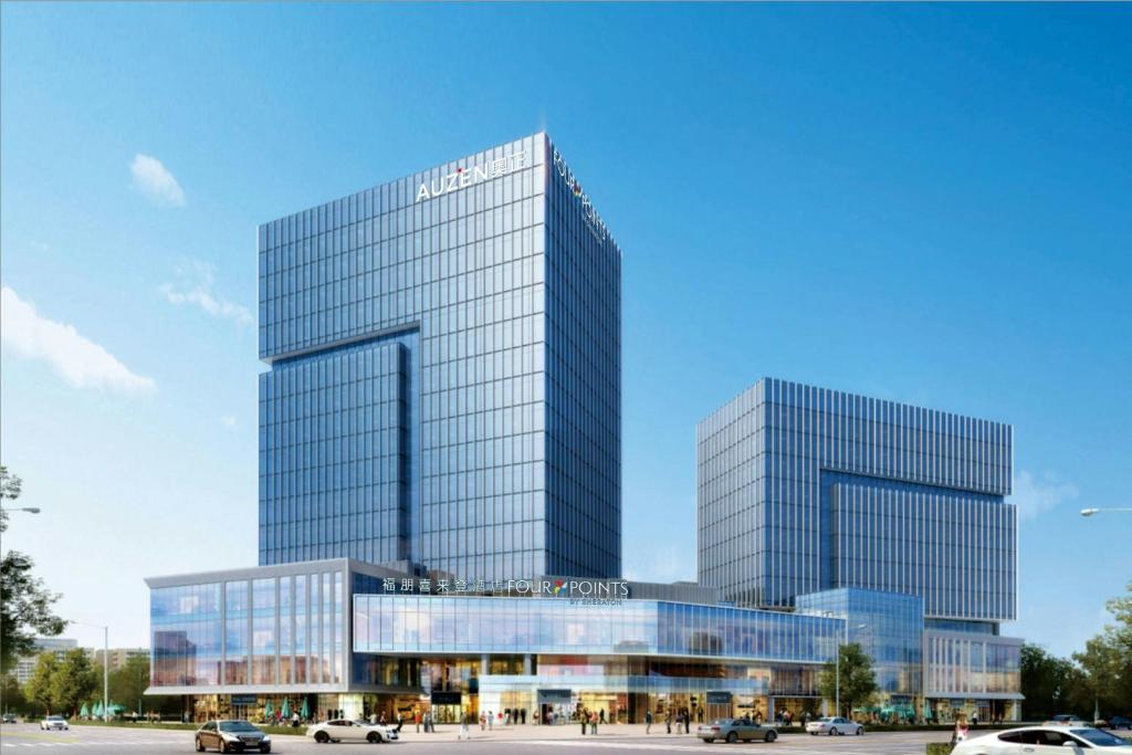 two tall glass buildings with cars in front of them at Four Points by Sheraton Linyi Hedong in Linyi