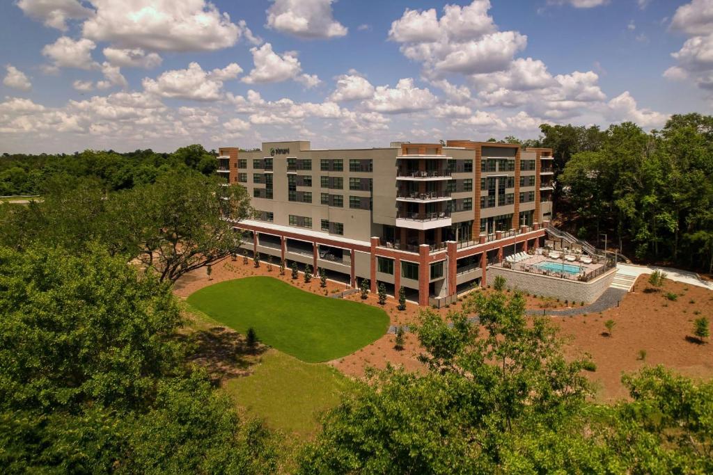 an aerial view of a building with a golf course at Element by Marriott Bainbridge Riverfront in Bainbridge