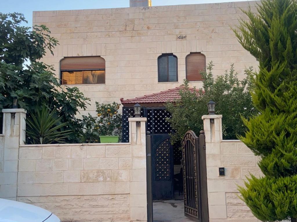 a house with a gate and a fence at alrayan in King Faisal Airbase