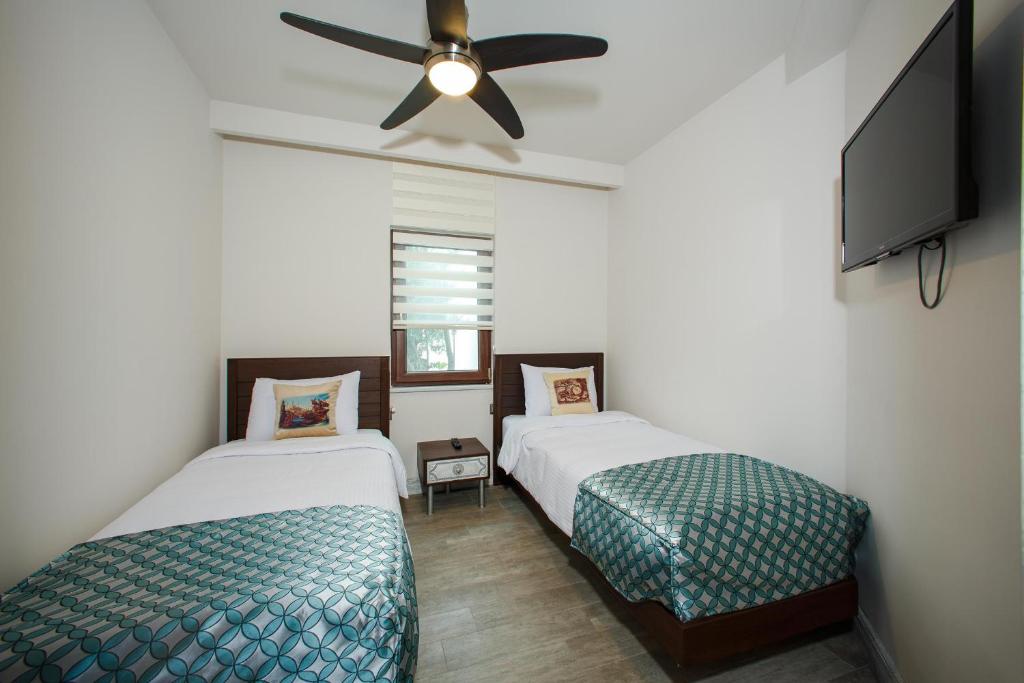 Postel nebo postele na pokoji v ubytování Assos Barbarossa Special Class Hotel
