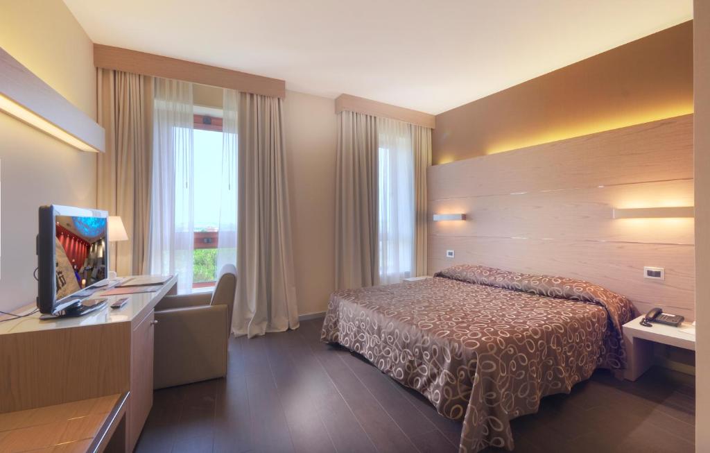 Postel nebo postele na pokoji v ubytování Hotel Federico II