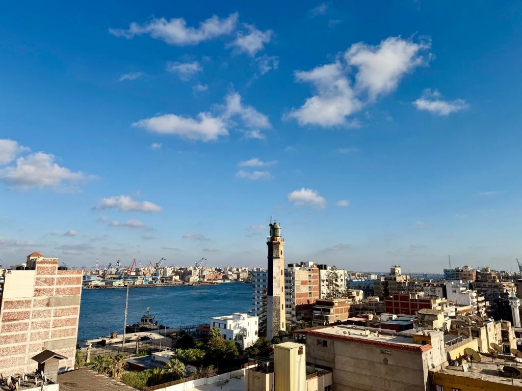 a view of the city from the roof of a building at Retaj Waterfront Penthouse in Port Said