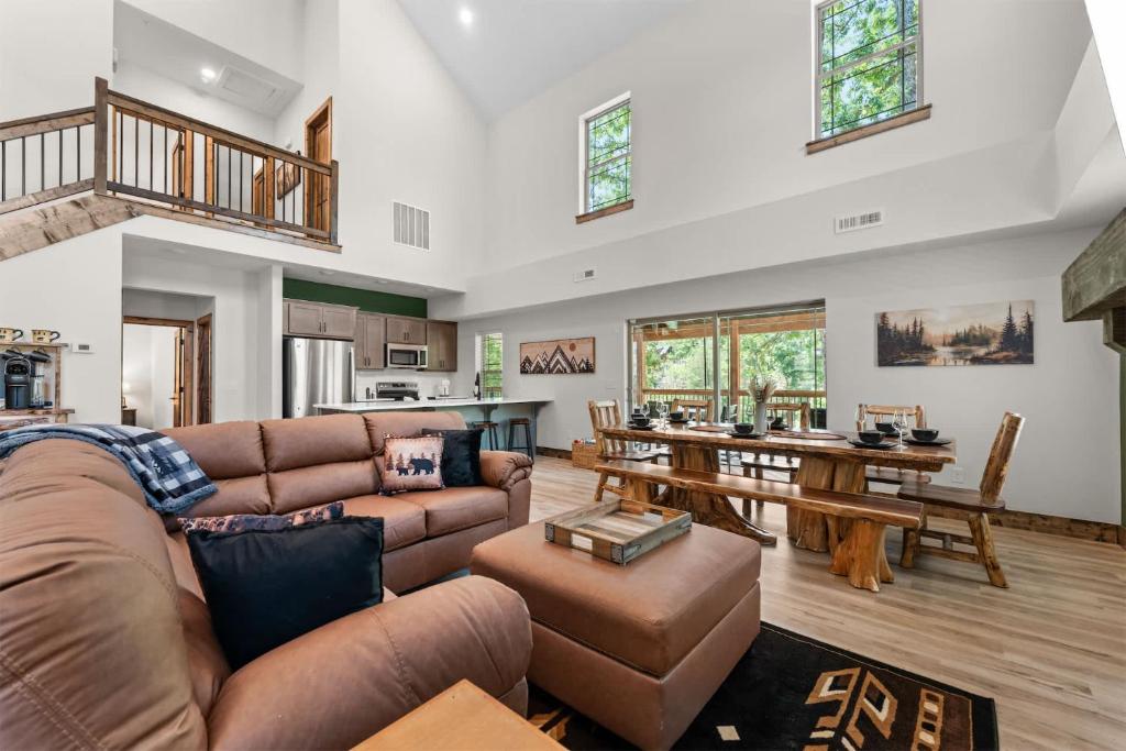 a living room with a couch and a table at LakeSides Retreat with Amenities in Hollister