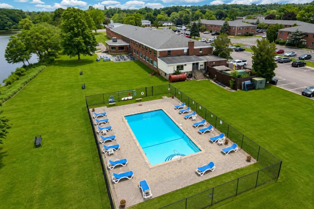 an overhead view of a pool with lounge chairs and a building at Lakeside Inn in Wakefield