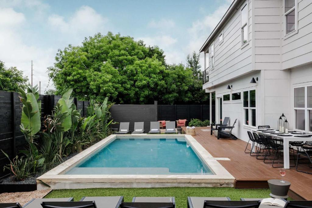 a swimming pool in the backyard of a house at Expansive Luxury Escape with Private Pool in Austin