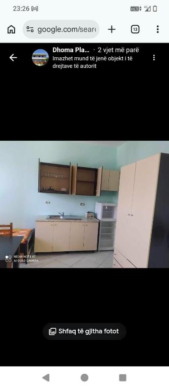 a screenshot of a kitchen with a picture of a refrigerator at Vila Gega in Tale