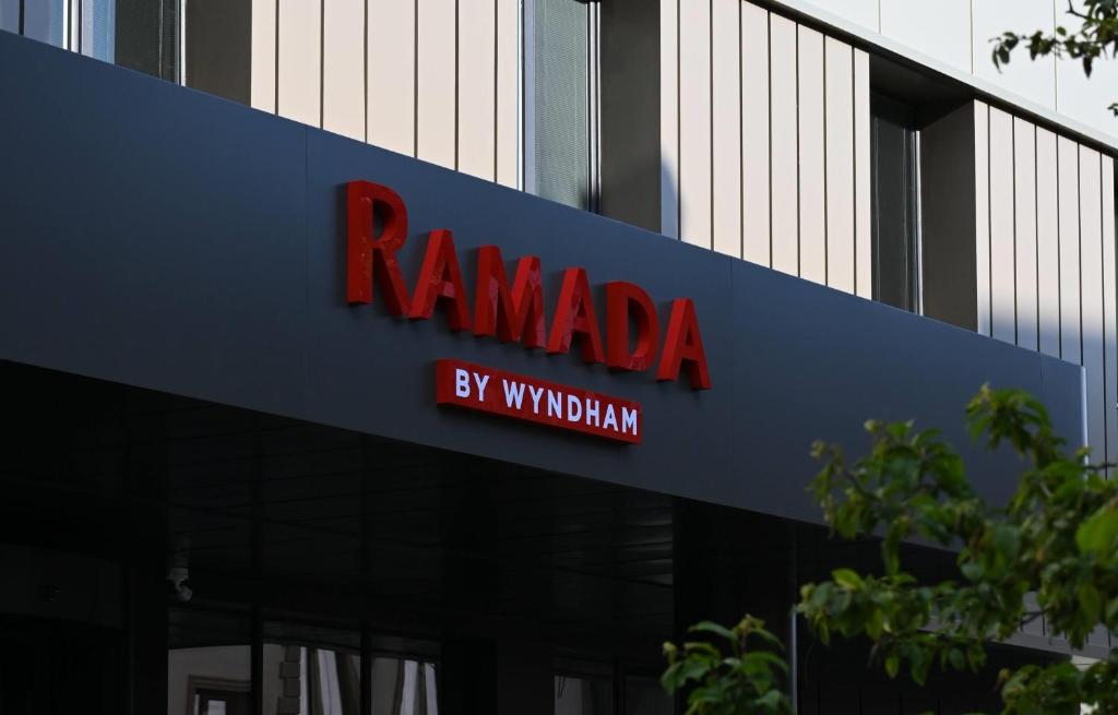 a red sign on the side of a building at Ramada by Wyndham Duzce in Duzce