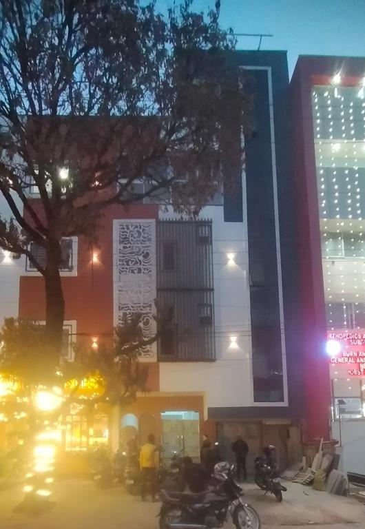 a group of motorcycles parked in front of a building at Vista10 in Bhopal