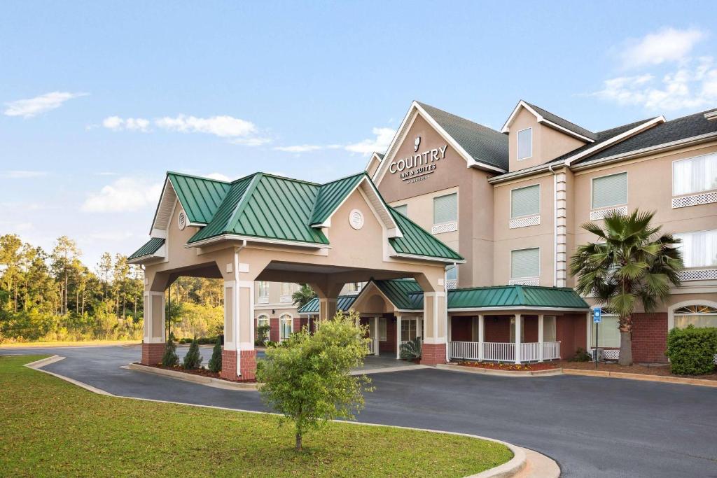 a rendering of a hotel with a parking lot at Country Inn & Suites by Radisson, Albany, GA in Albany