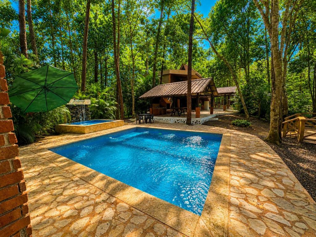 a swimming pool in a yard with a gazebo at Villas alpinas in Concepción de La Vega