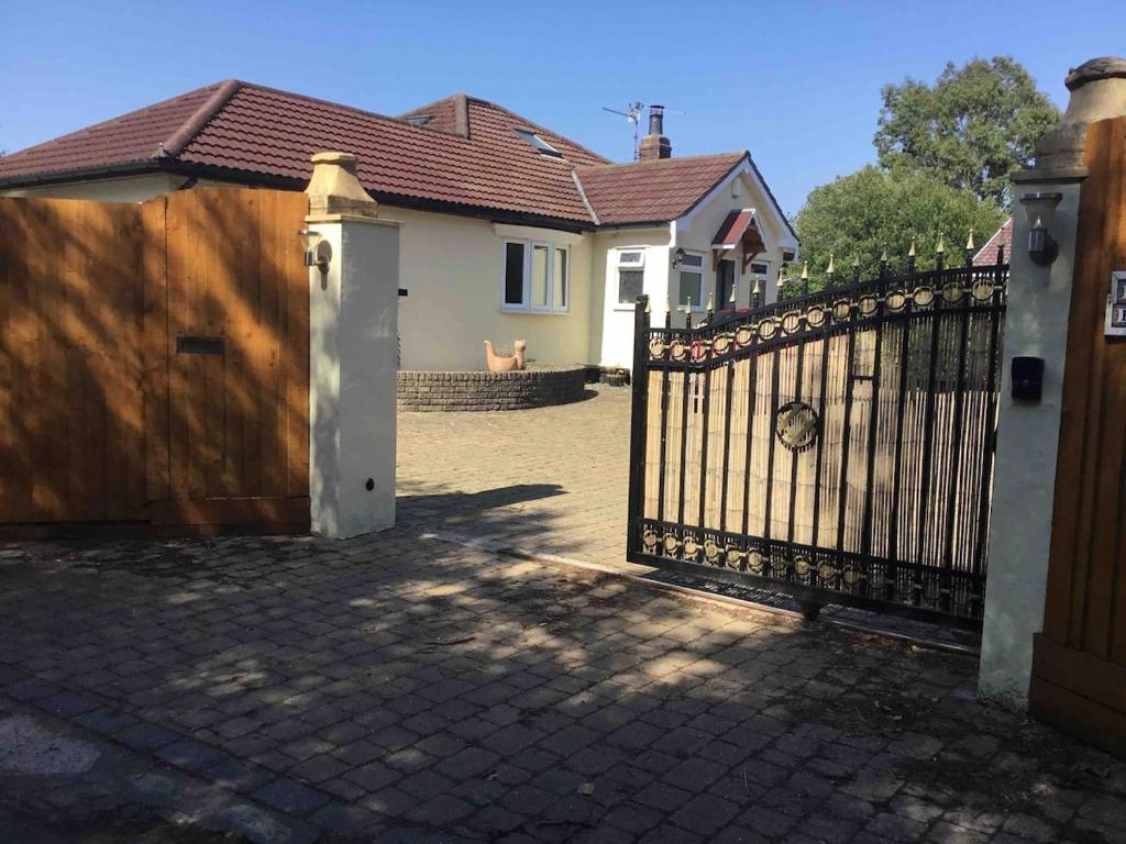 a wooden gate in front of a house at Fishermans Rest in Newport