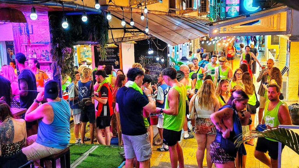 a group of people standing in a crowd at a party at Blanco Central in Phi Phi Islands