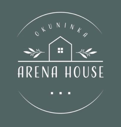 a logo for anemia house on a blue background at Arena White Houses in Okuninka